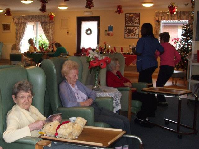 nursing home residents sitting in chairs