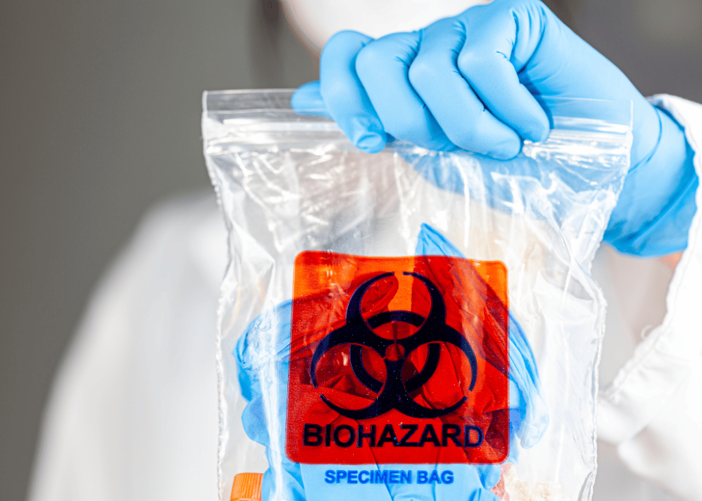 A person holding a Biohazard Bag